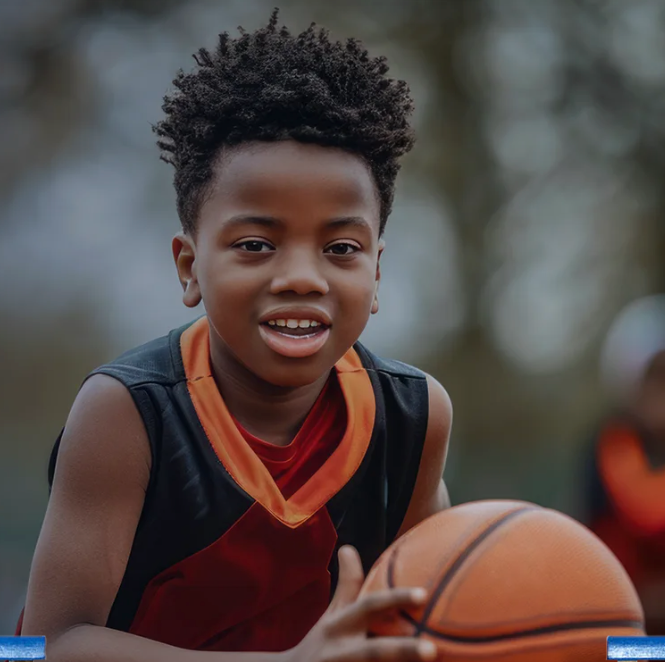Young basketball player smiling on the court
